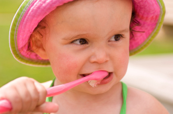 Girl brushing teeth